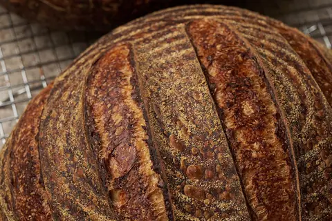 Two loaves of rustic sourdough bread — illustrative photo