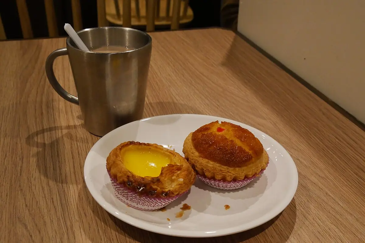 A egg tart and coconut tart in Cafe 2.0 — illustrative photo