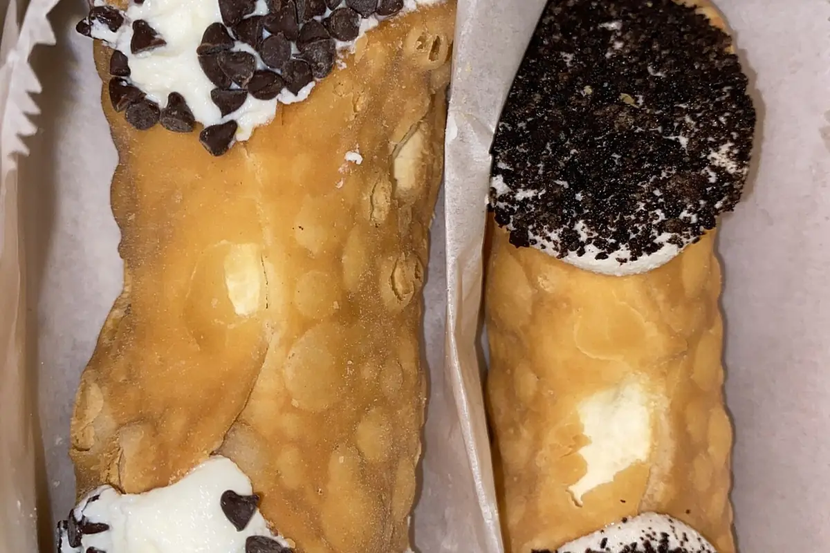 A chocolate chip cannoli (left) and cookies & cream cannoli (right) from Mike's Pastry in Boston, MA — illustrative photo